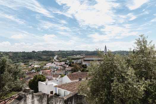 Obidos, Portugal - April 12, 2019: View of the countryside and the houses surrounding the city on a spring day