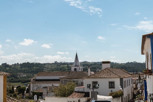 Obidos, Portugal - April 12, 2019: View of the countryside and the houses surrounding the city on a spring day