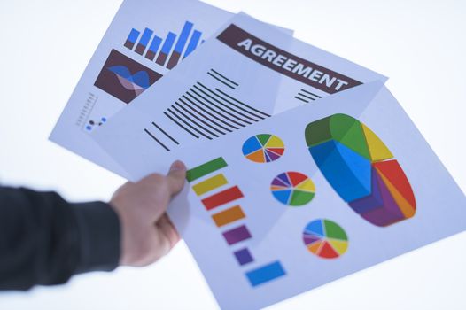 Businessman hand holding a document. Scenes white background.