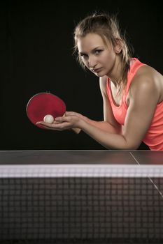 young beautiful athletic girl playing ping pong