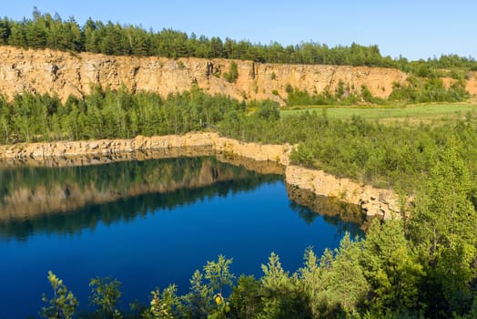 Flooded old quarry in Grodek park in Jaworzno, Poland