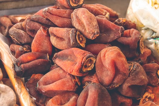 Dried persimmons, seasonal winter and autumn food as well as a traditional export product of Japan and Vietnam