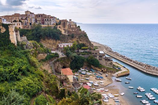 Aerial view of Pizzo town in Calabria with small boat pier at the beach