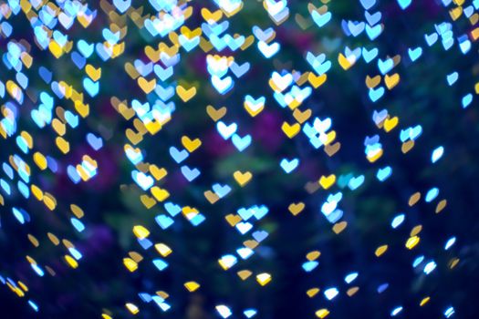 abstract blur bokeh heart shape love valentine day on tree in garden night light