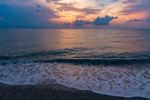 Picturesque sunset on the Calabrian beach in Italy