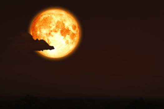 full egg moon back on silhouette mountain on night sky, Elements of this image furnished by NASA