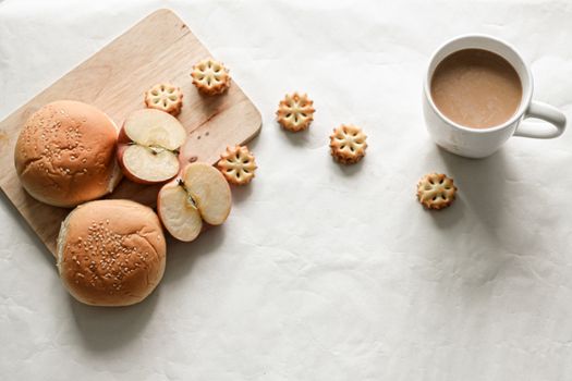 Home baked bread, biscuits and apple slices showing the comfort and cozy feeling of being at home