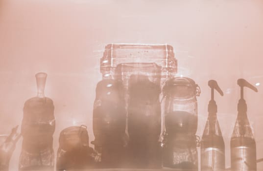 Conceptual photo showing the silhouettes of glass bottle containers to show concept of sanitation, infection control and good hygiene to fight the spread of covid-19 pandemic