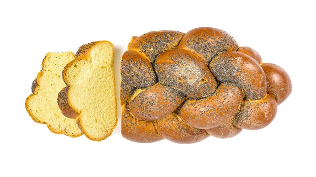 Fresh sliced challah bread isolated on white background with clipping path