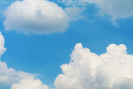 pure heap cloud and sunlight shining and pass on blue sky in summer season