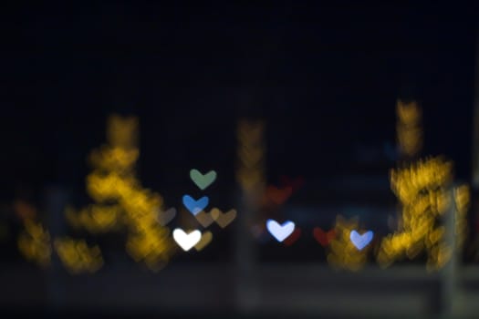 yellow bokeh and blur heart shape love valentine day colorful night light on street