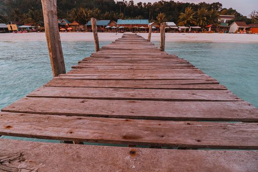 Wooden pier leading to Sok San Beach in Koh Rong Island of Cambodia, a popular summer vacation destination for tourist