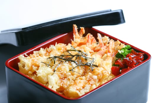 Ebi tempura don or Ebi Kakiage served with red pickled vegetables (Fukujin Zuke) in white background