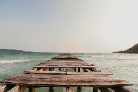 Conceptual photo of a broken wooden pier showing concept of the importance of supporting mental health, social isolation and social distancing during the covid-19 pandemic