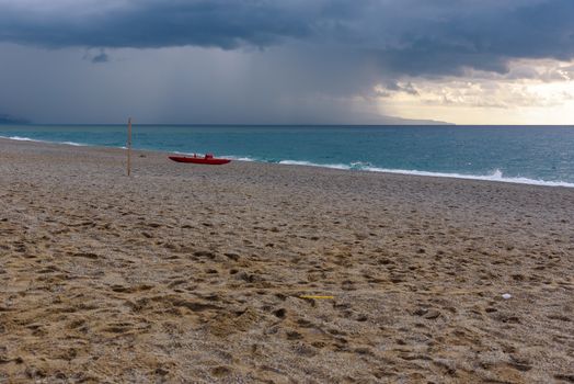 Dark clouds over the calabrian beach before the storm