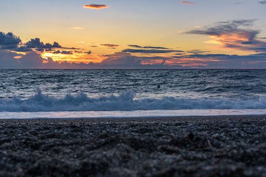 Picturesque sunset on the Calabrian beach in Italy