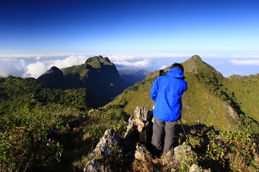 Male photographer admired the beauty and take a photo on Doi Luang Chiang Dao, Chiang Mai, Thailand