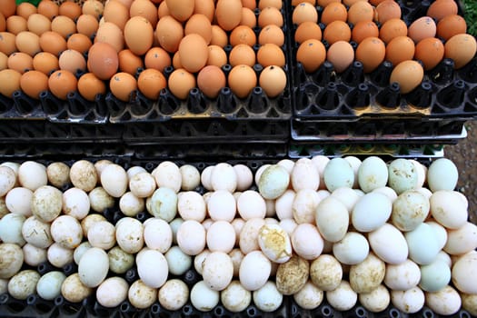 Many fresh duck eggs and fresh chicken eggs. Morning market, Thailand