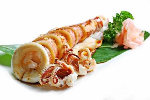 Grilled ika yaki, Fresh squid grill sliced into rings with the tentacles on white background
