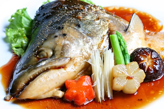 Salmon head steamed with sweet sauce and vegetable (Salmon Kabutoni) Japanese foods style