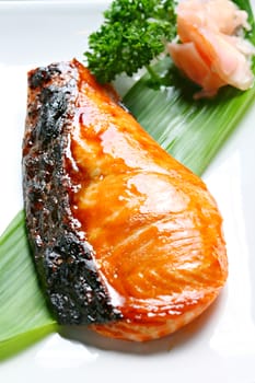 Salmon Shioyaki (Salted Grilled Salmon) served with pickled ginger in white background