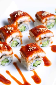 Dragon Rolls or Sea Eel Rolls Cream Cheese and Avocado inside. Topped with Smoked Eel (unagi)