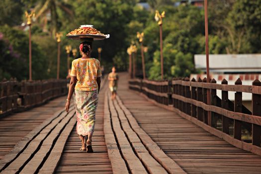 A wonderful balance Special skills of Female Mon people on Uttamanusorn Bridge Sangkhla buri, Kanchanaburi province in Thailand