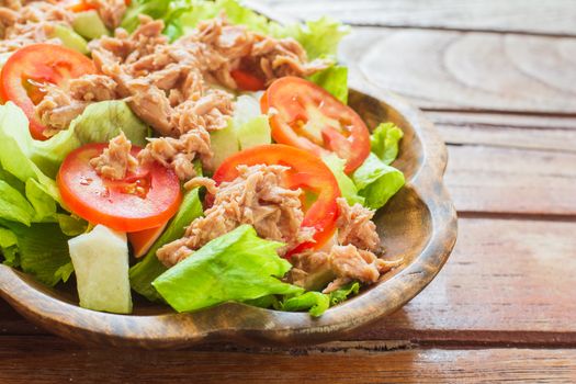 Tuna salad with red raw tomato, fresh lettuce. Hight vitamins and low fat for loose weight. Heathy food concept.