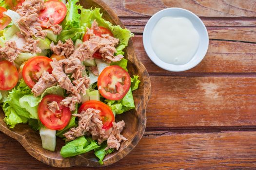 Tuna salad with red raw tomato, fresh lettuce. Hight vitamins and low fat for loose weight. Heathy food concept.