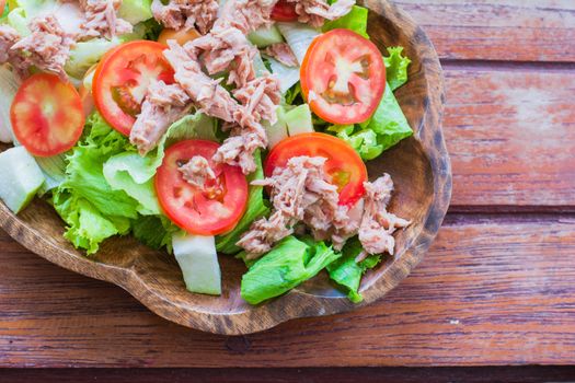 Tuna salad with red raw tomato, fresh lettuce. Hight vitamins and low fat for loose weight. Heathy food concept.