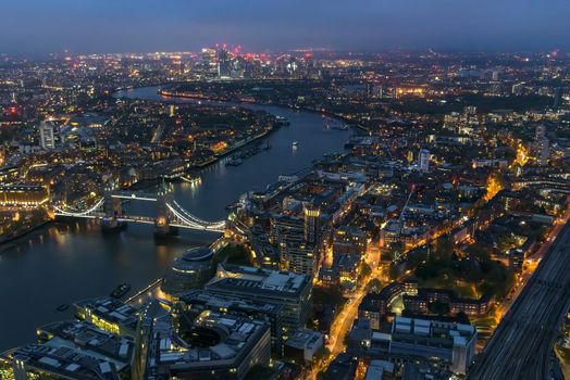Aerial view of river Thames in London on a cloudy night