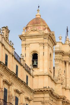 Closeup of the belltower of the historic baroque cathedral called Basilica Minore di San Nicolo in Noto, Sicily, Italy