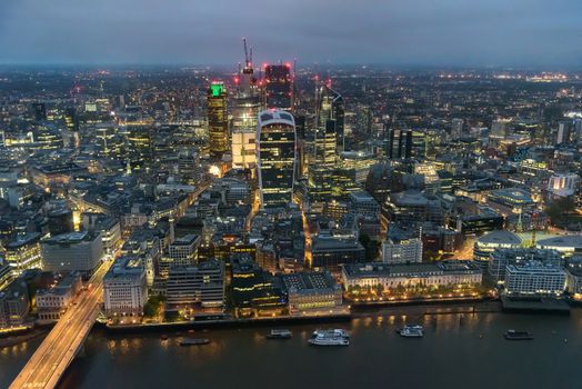 Aerial view of City of London at night on a cloudy day