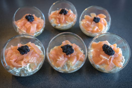 verrine salmon lumpfish egg fresh cheese and avocado bed in the kitchen