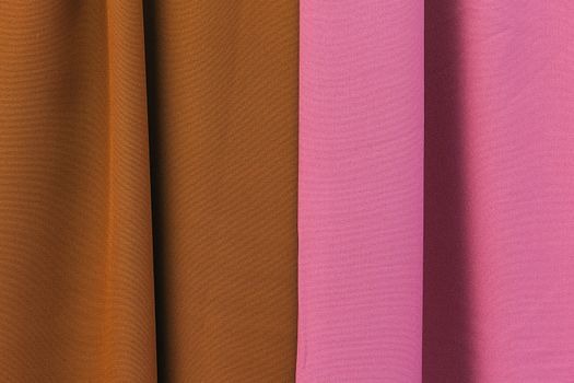 Detailed close up view on samples of cloth and fabrics in different colors found at a fabrics market.