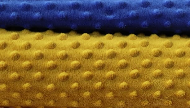 Detailed close up view on samples of cloth and fabrics in different colors found at a fabrics market.