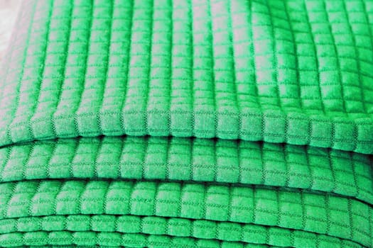 Detailed close up view on samples of cloth and fabrics in different colors found at a fabrics market.