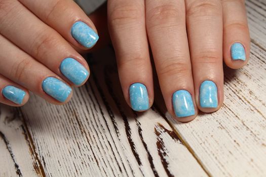 Christmas design manicure with snowflakes at the end of the nails.