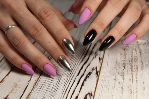 The refined beautiful female fingers with original design manicure