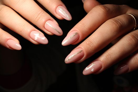 Christmas design manicure with snowflakes at the end of the nails.