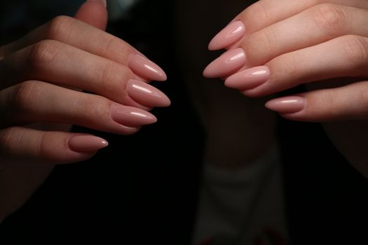 Multi-colored pastel manicure combined tone on tone with a striped background.