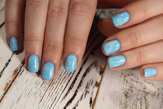 Christmas design manicure with snowflakes at the end of the nails.