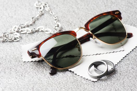 accessories for men, close up at brown sunglasses.