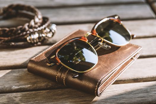 accessories for men, close up at brown sunglasses.