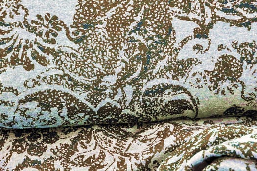 Detailed close up view on samples of cloth and fabrics in different colors found at a fabrics market.