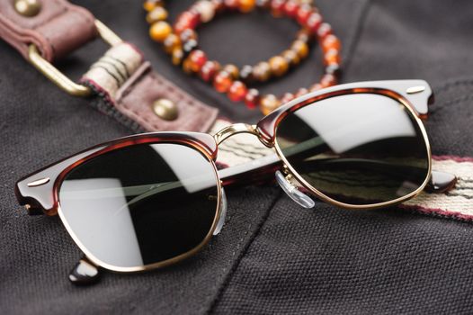 accessories for men, close up at brown sunglasses.