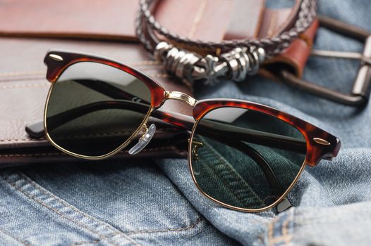 accessories for men, close up at brown sunglasses.