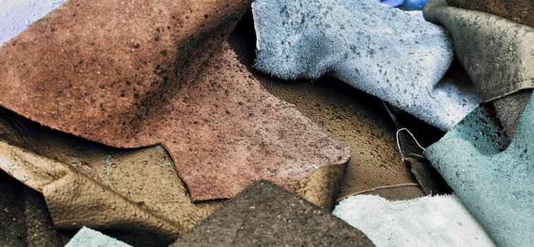 Detailed close up view on samples of cloth and fabrics in different colors found at a fabrics market.