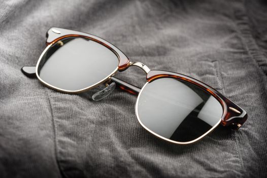 accessories for men, close up at brown sunglasses.