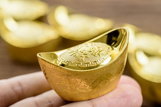 chinese gold ingot or chinese gold nugget with the chinese text on the top mean "get your money worth".